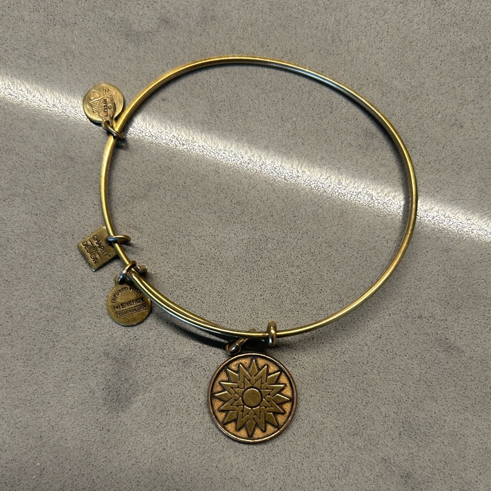 Brass Alex and Ani bracelet with Sun/star burst